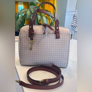 Tan Fossil bag with black/white heart accents.